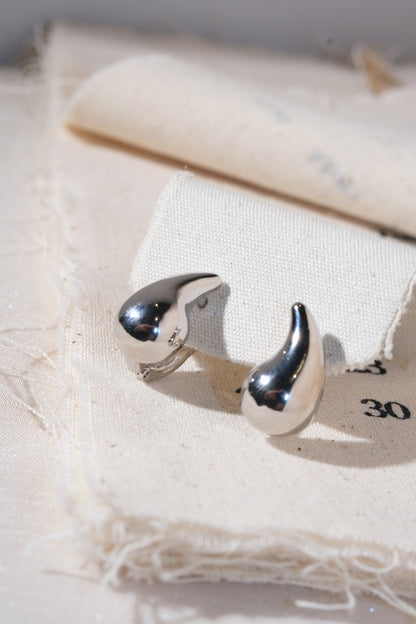 Silver Sculpted Teardrop Earrings — edited real product photo