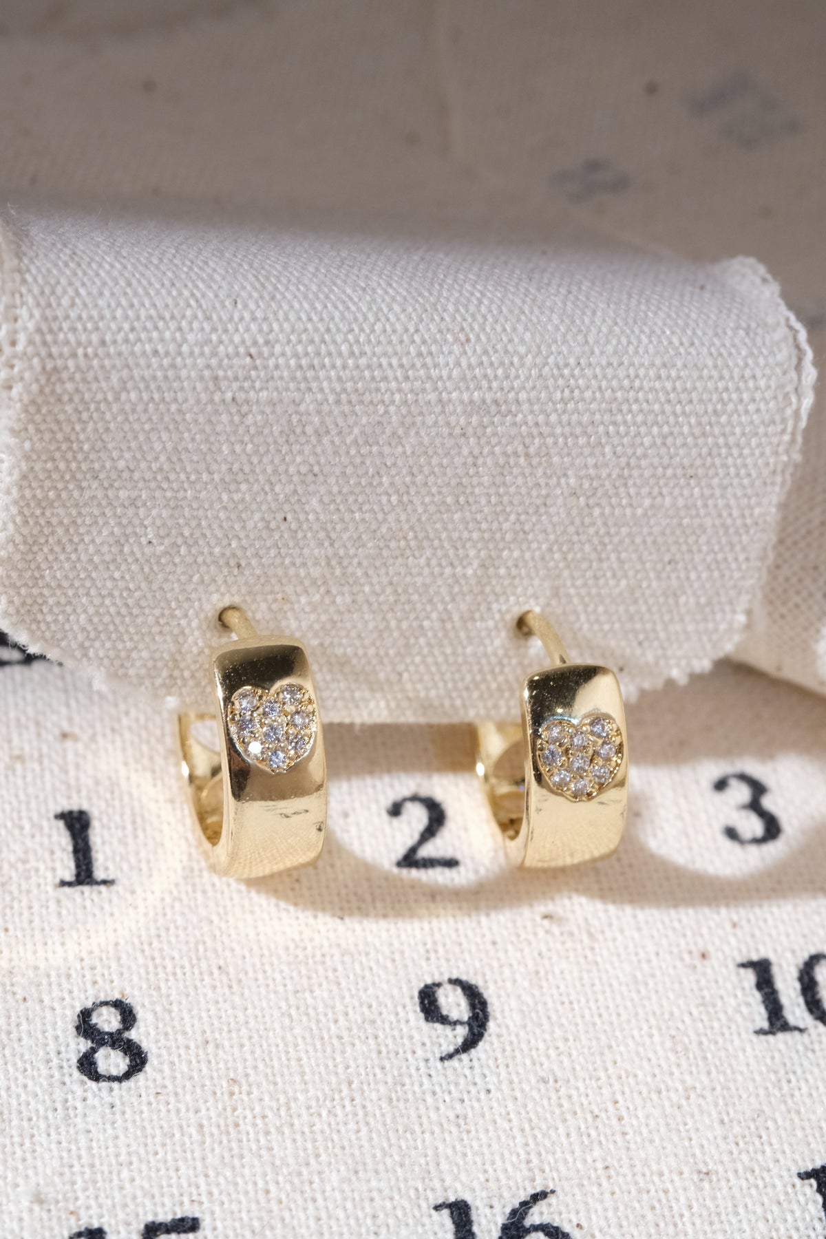 Gold Pave Heart Inlay Huggie Earrings — edited real product photo