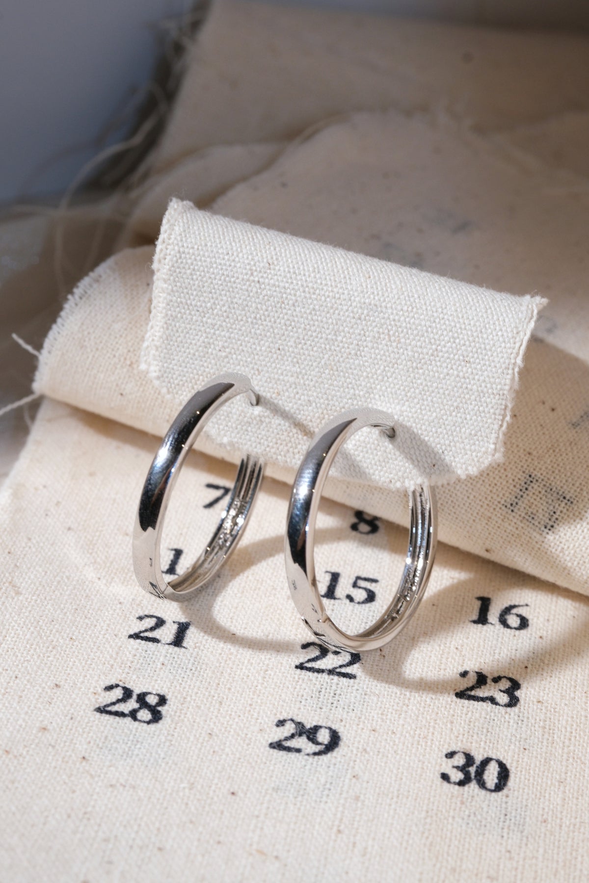 Silver Polished Hoop Earrings — edited real product photo
