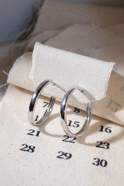 Silver Polished Hoop Earrings — edited real product photo