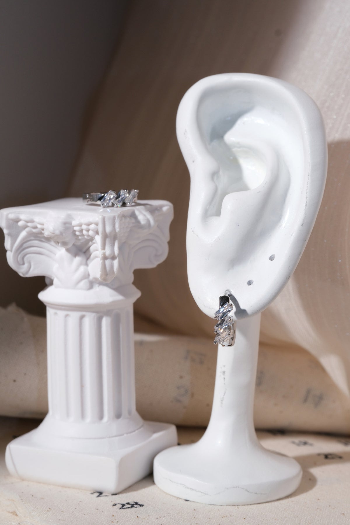 Silver Triple Baguette CZ Huggie Earrings — edited real product photo