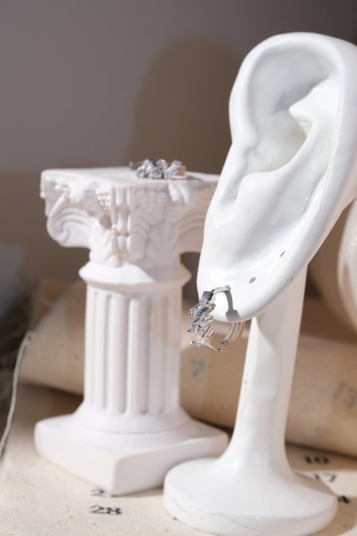 Silver Triple Baguette CZ Huggie Earrings — edited real product photo