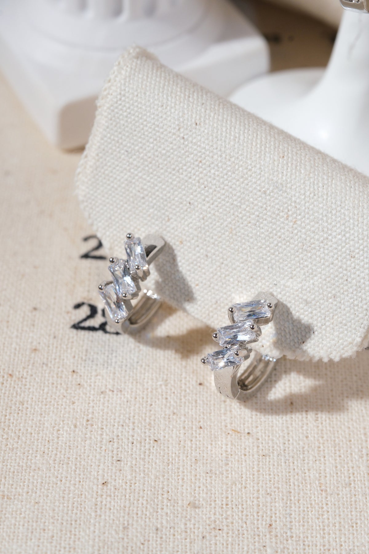 Silver Triple Baguette CZ Huggie Earrings — edited real product photo