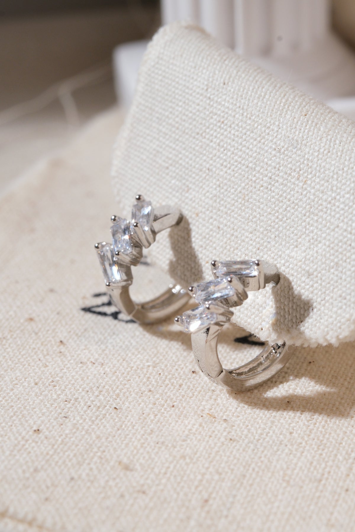 Silver Triple Baguette CZ Huggie Earrings — edited real product photo