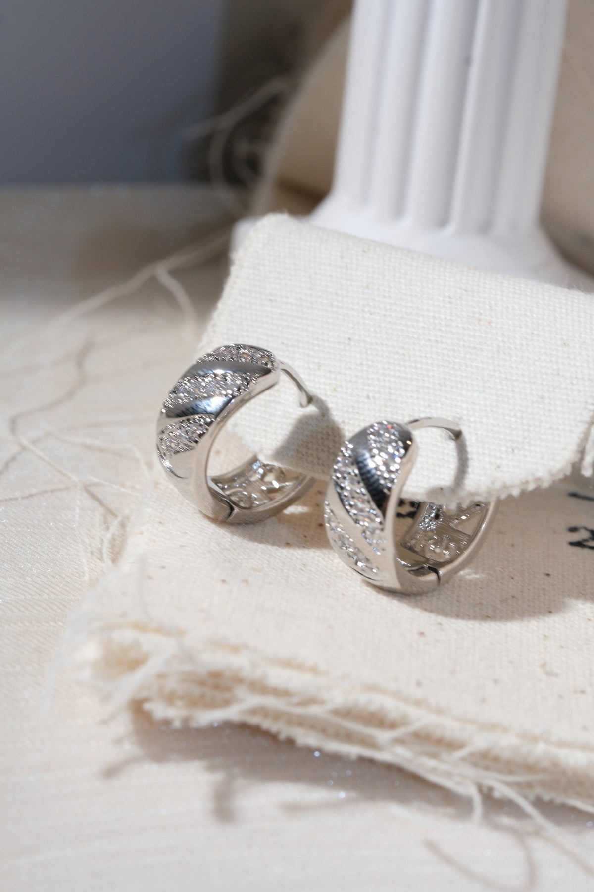 Silver Diagonal Pave Huggie Earrings — edited real product photo