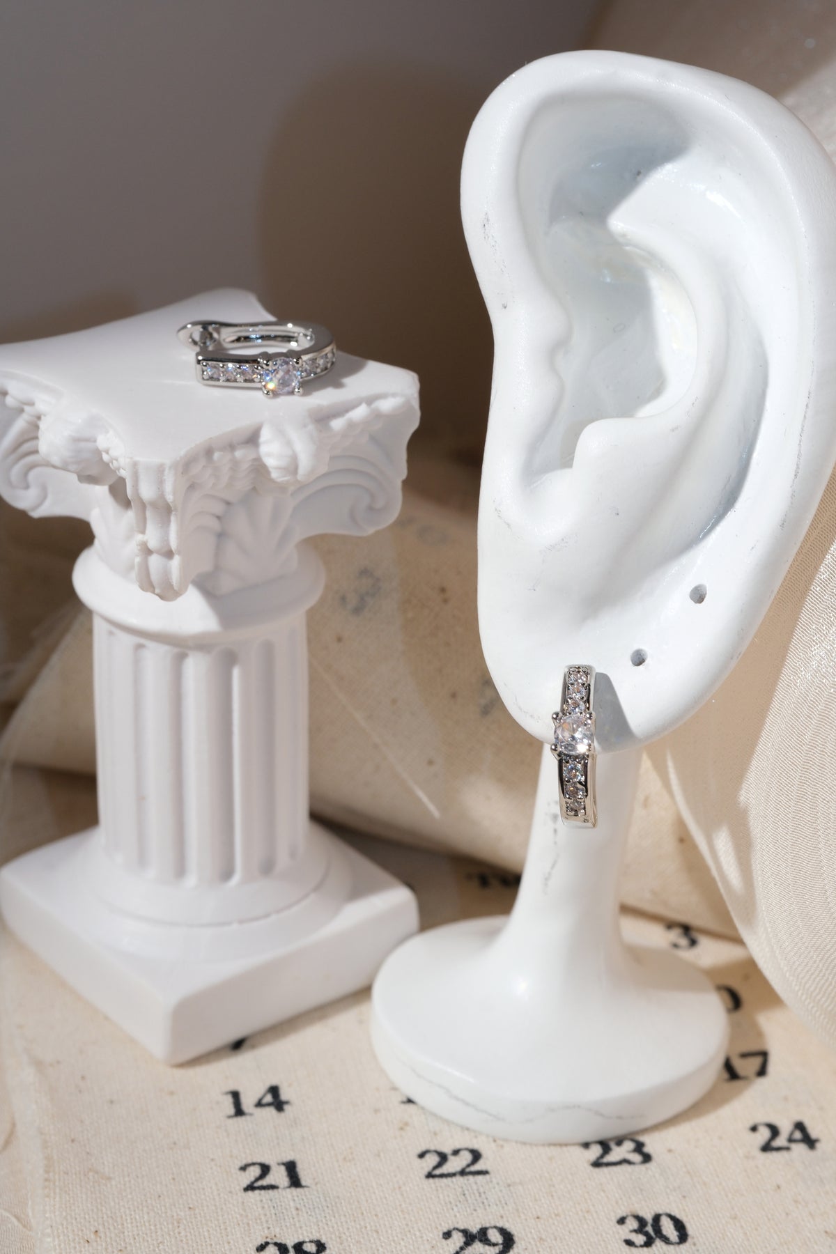 Silver Solitaire CZ Huggie Earrings — edited real product photo