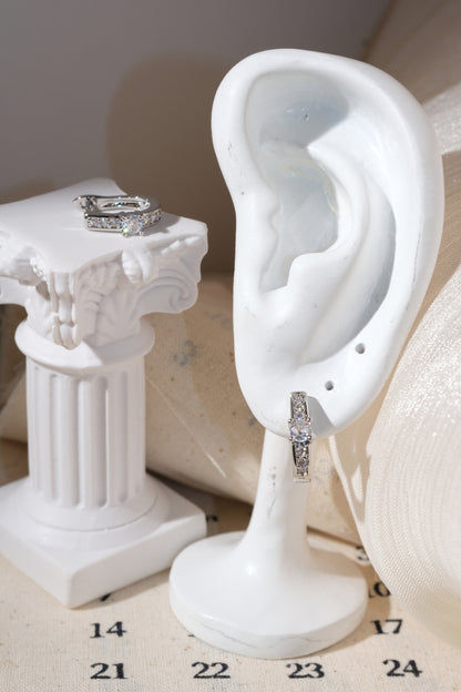 Silver Solitaire CZ Huggie Earrings — edited real product photo