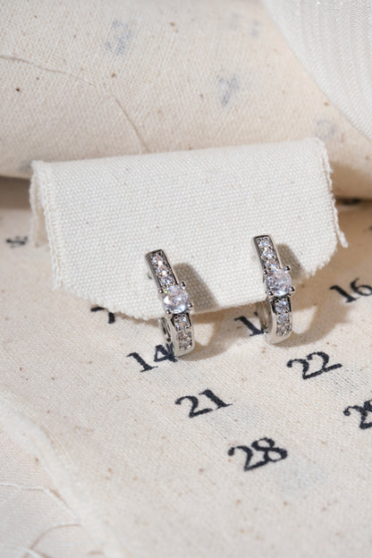 Silver Solitaire CZ Huggie Earrings — edited real product photo