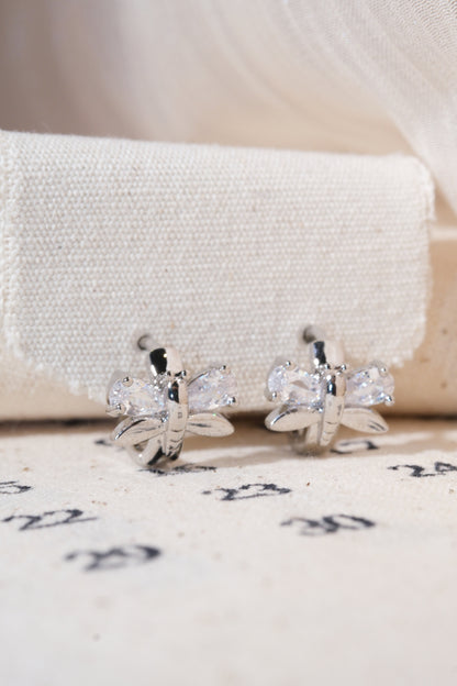 Silver Butterfly Wing Huggie Earrings — edited real product photo
