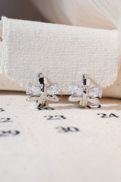 Silver Butterfly Wing Huggie Earrings — edited real product photo