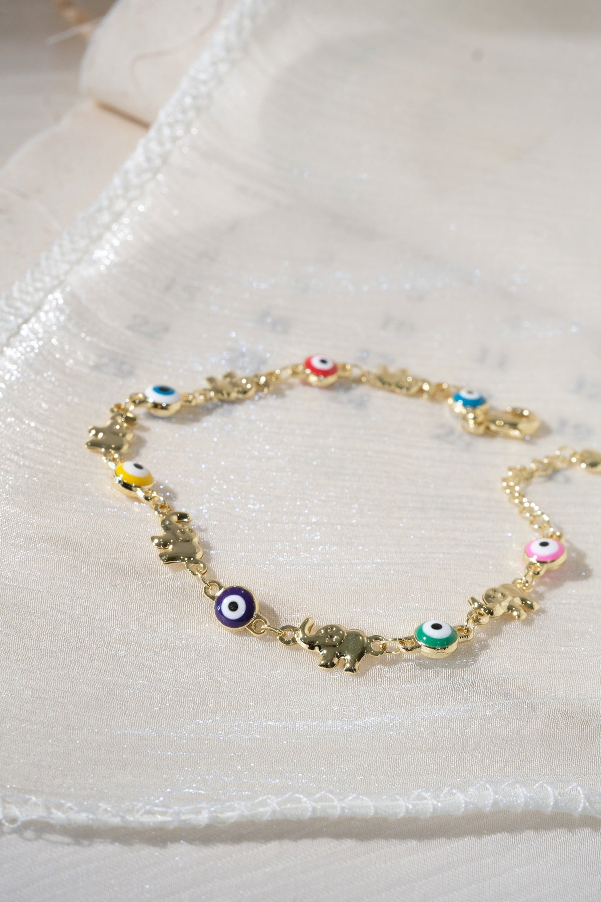 Colorful Eye and Elephant Bracelet — Gold — edited real product photo