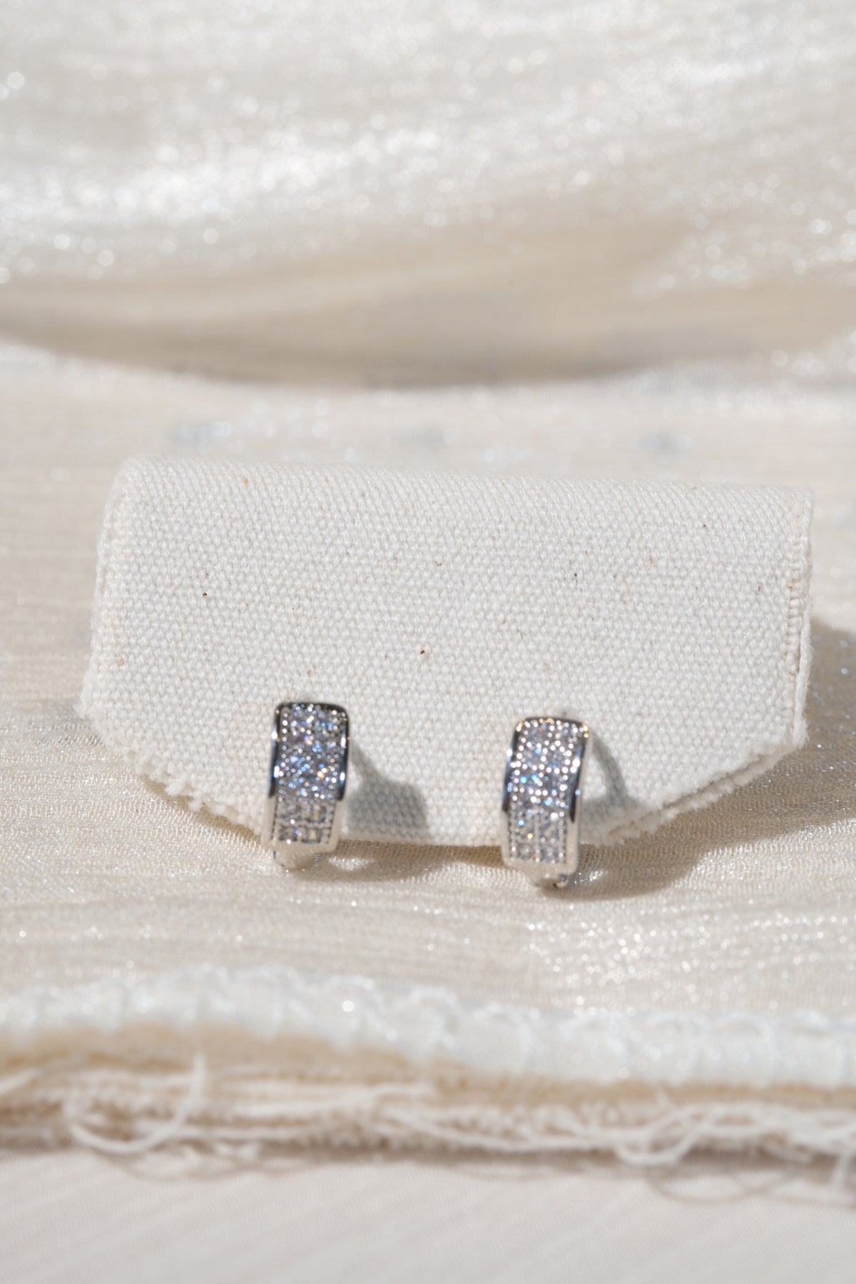 Wide Pave Huggies — Silver — edited real product photo