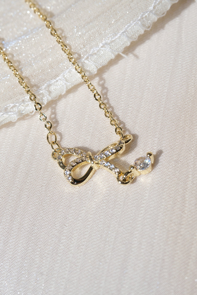 CZ Bow Drop Necklace — Gold — worn