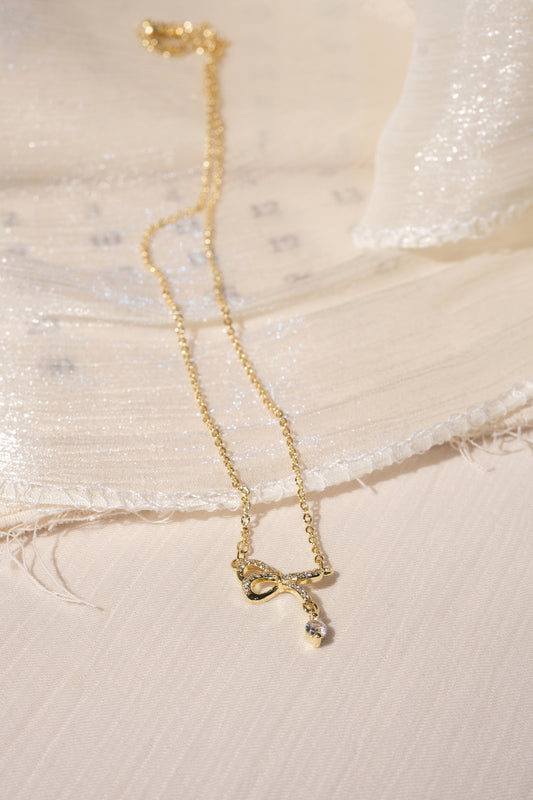 CZ Bow Drop Necklace — Gold — edited real product photo