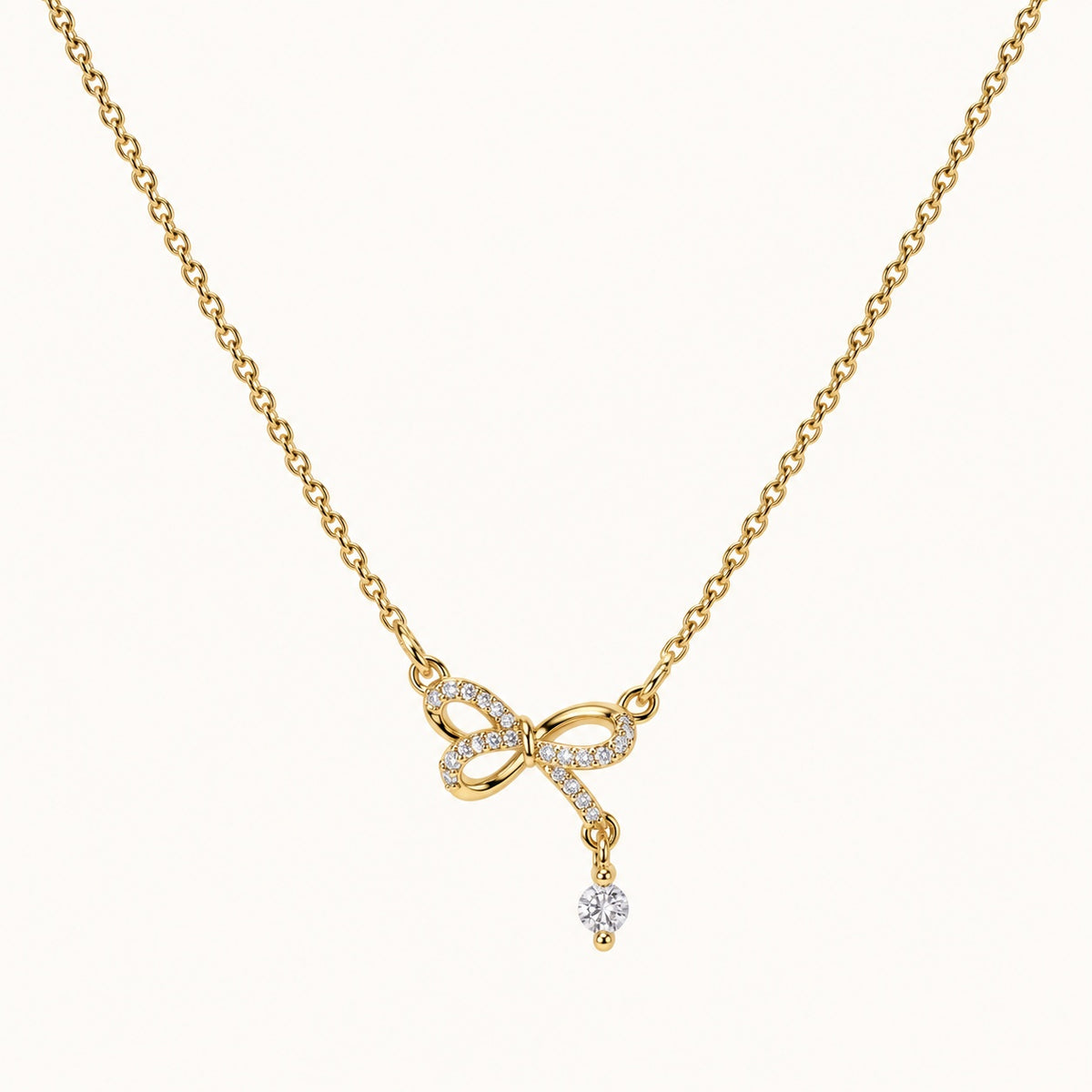 CZ Bow Drop Necklace — Gold — white background