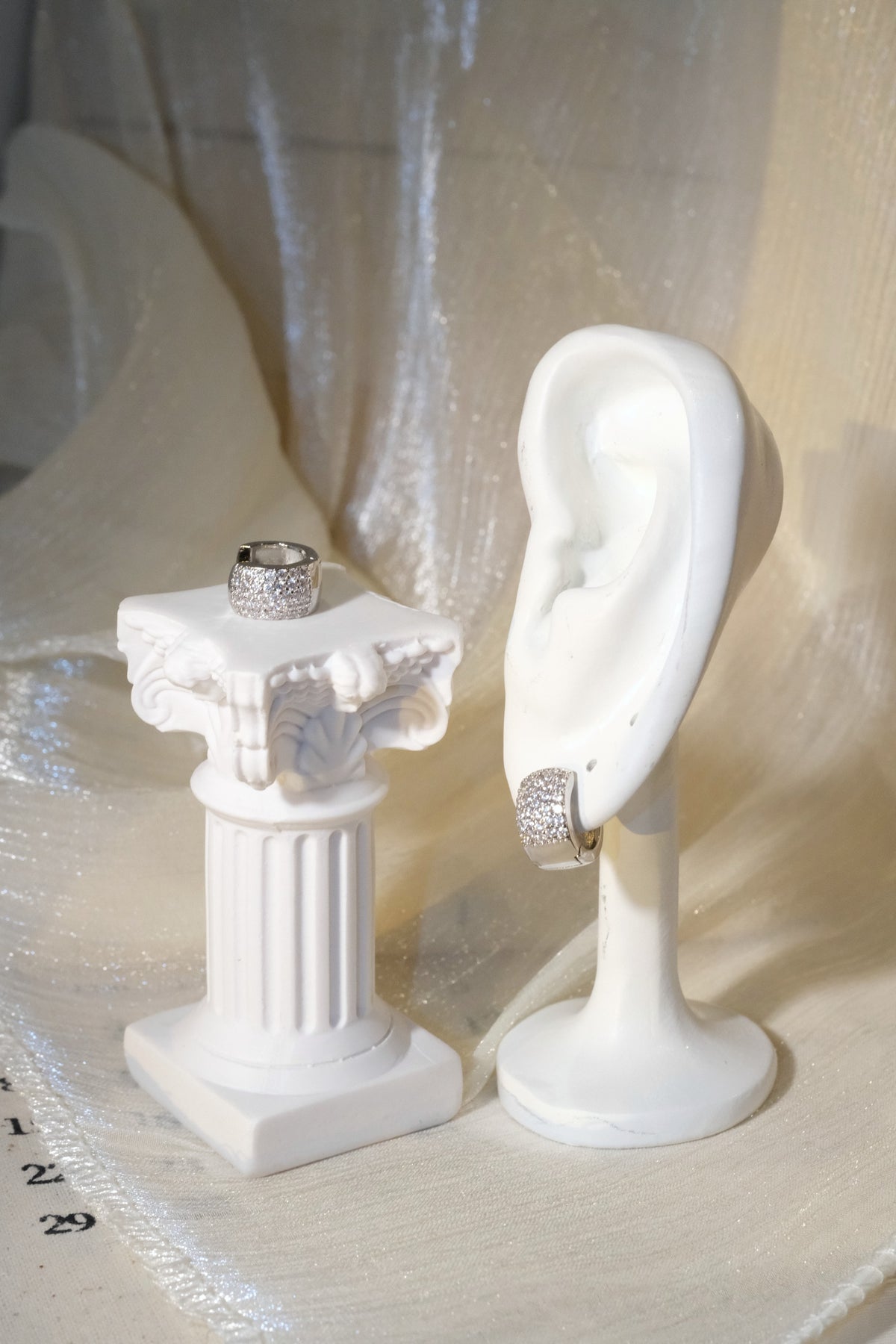 Wide Pavé Huggie Earrings — Silver — edited real product photo