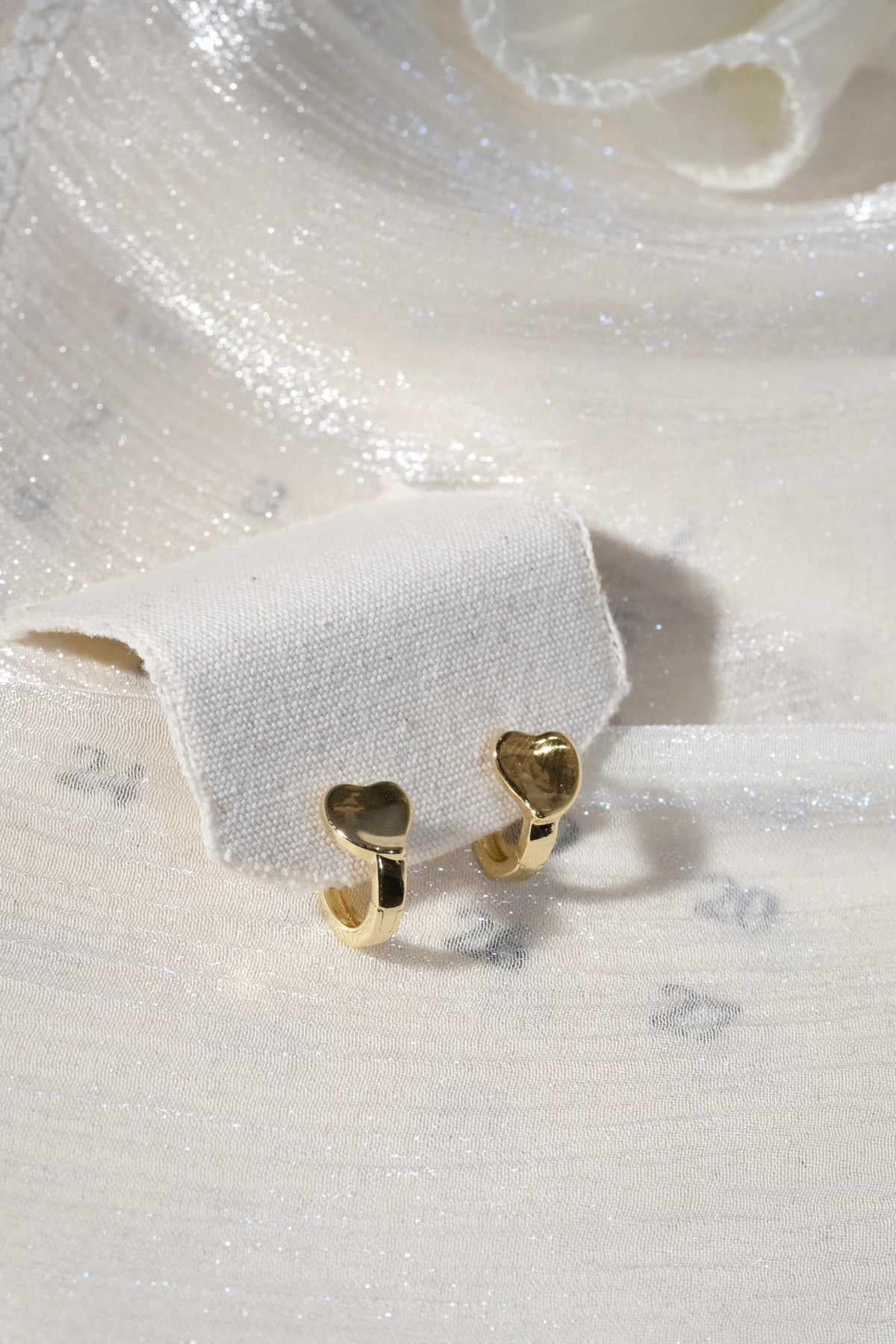 Heart Front Huggie Earrings — Gold — edited real product photo