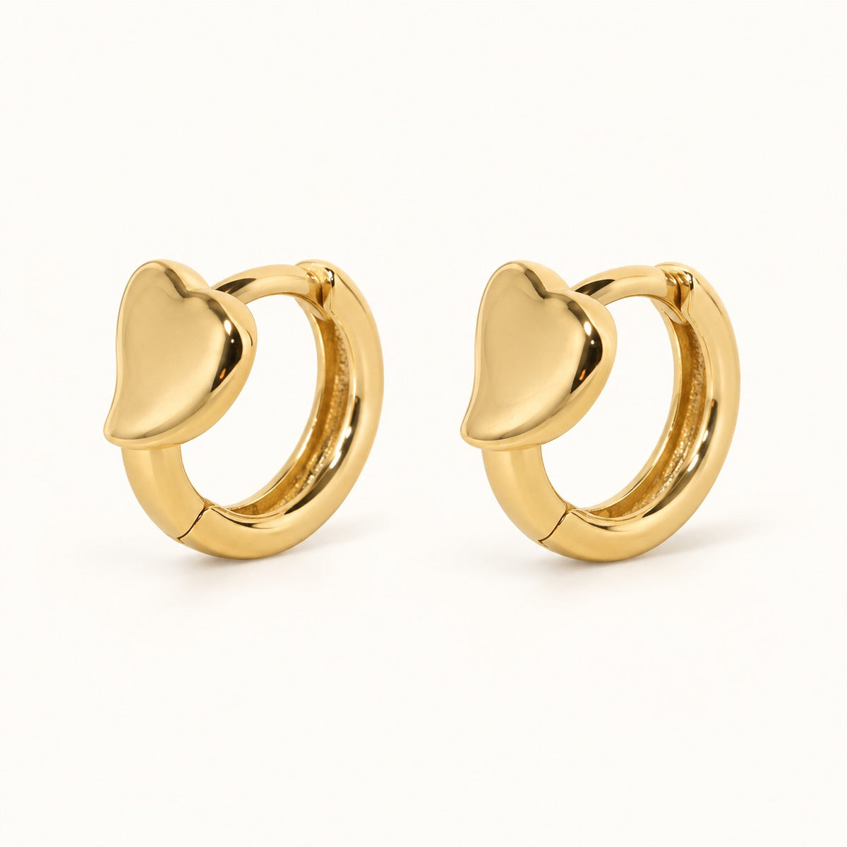 Heart Front Huggie Earrings — Gold — white background