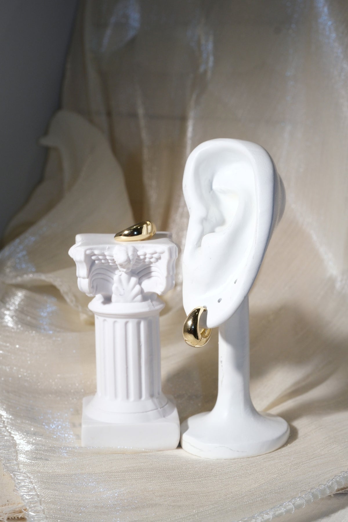 Rounded Huggie Earrings — Gold — edited real product photo