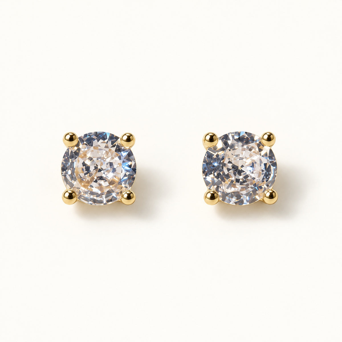 Solitaire CZ Stud Earrings — Gold — white background
