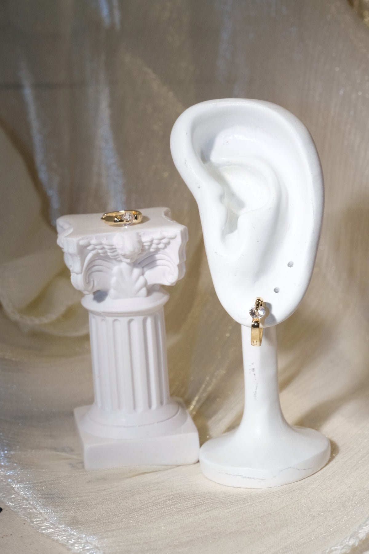 Solitaire CZ Huggie Earrings — Gold — edited real product photo