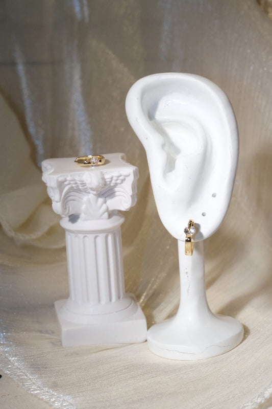Solitaire CZ Huggie Earrings — Gold — edited real product photo