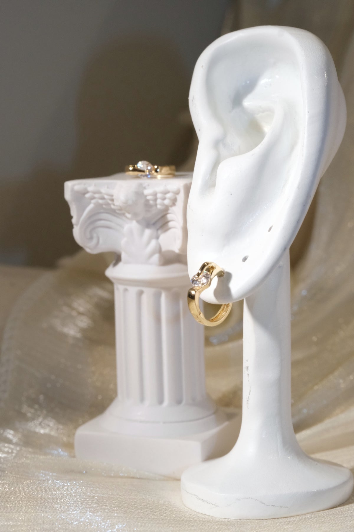 Solitaire CZ Huggie Earrings — Gold — edited real product photo