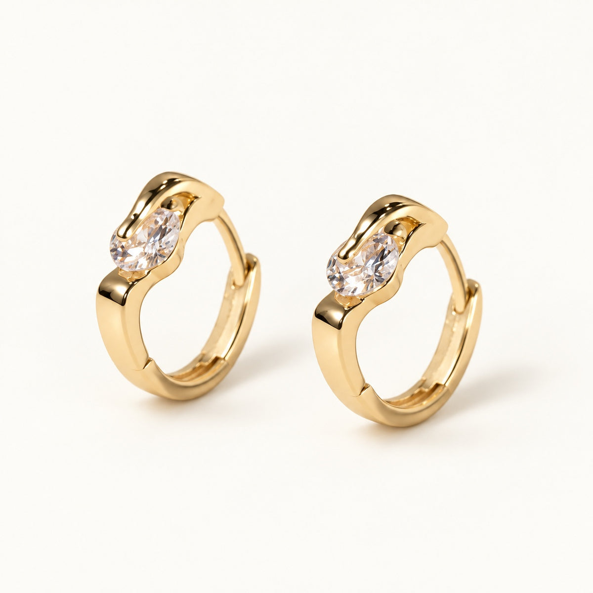 Solitaire CZ Huggie Earrings — Gold — white background