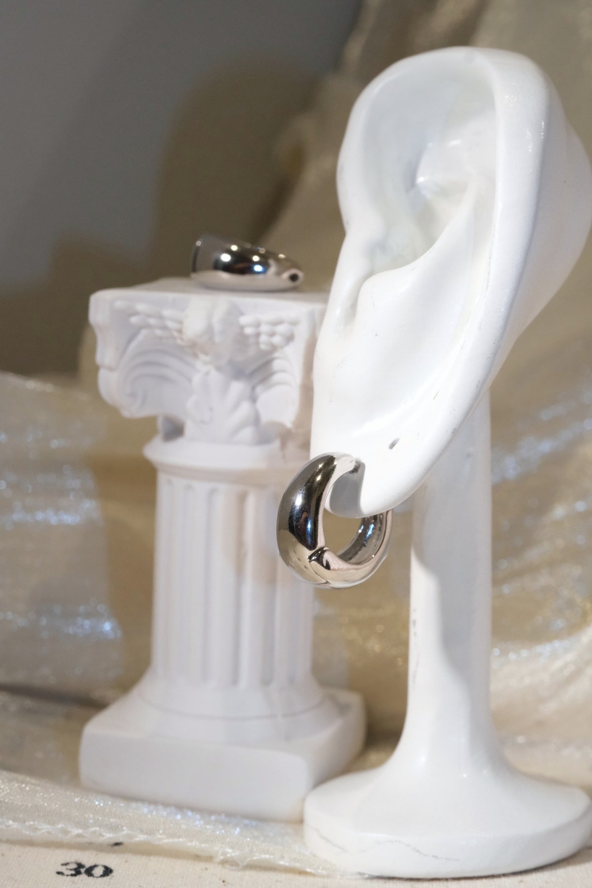 Rounded Huggie Earrings — Silver — edited real product photo