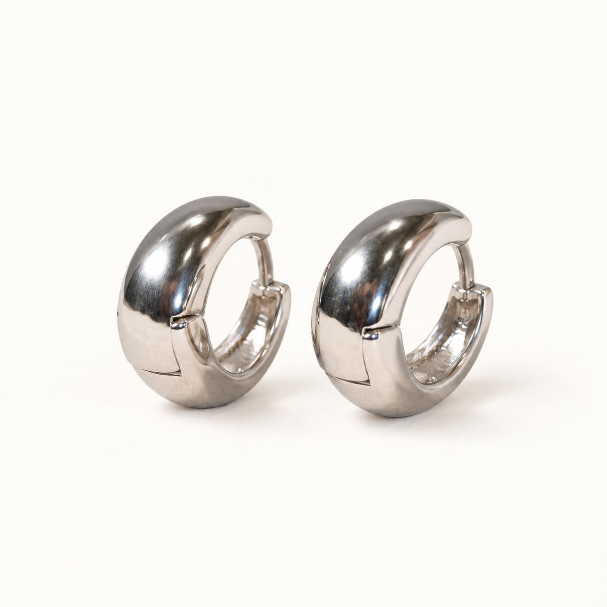 Rounded Huggie Earrings — Silver — white background