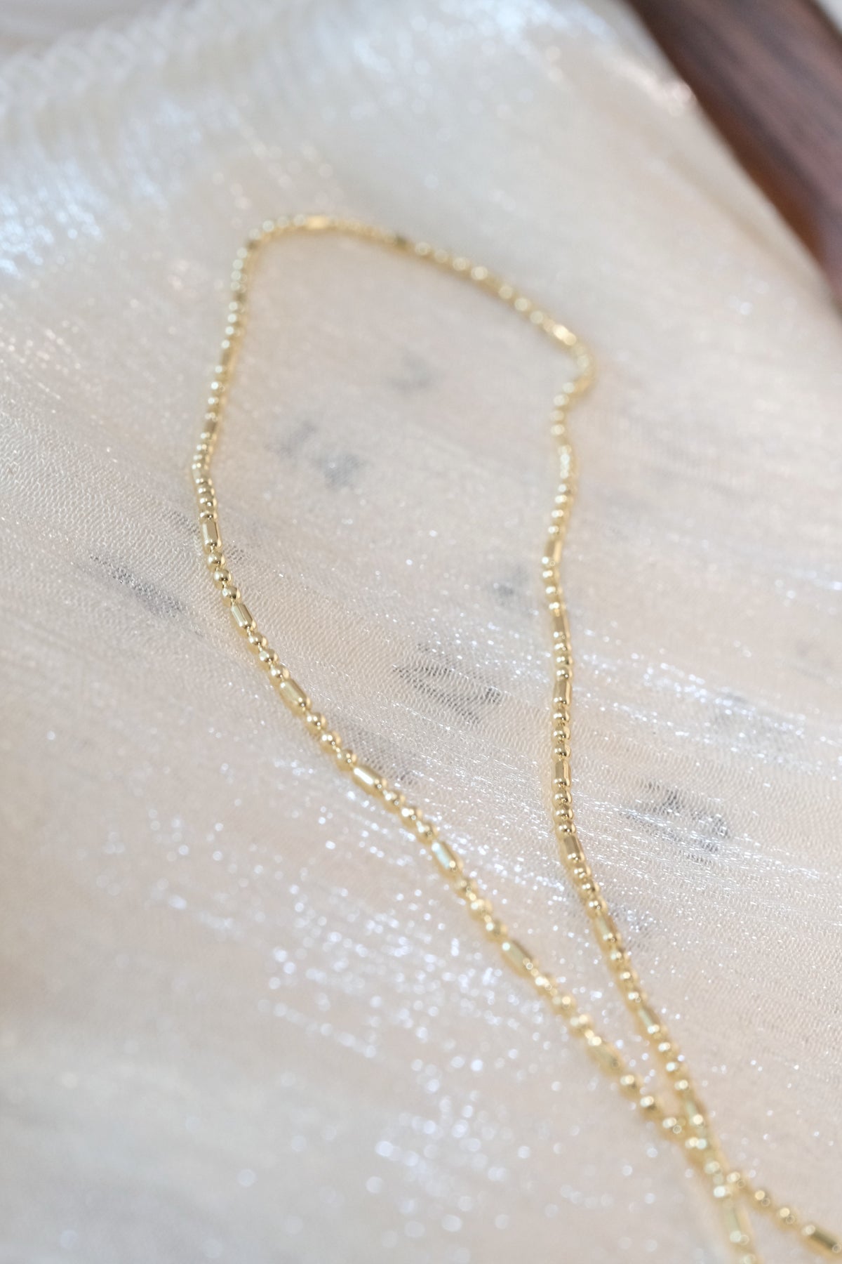 Ball and Bar Chain — Gold — edited real-life photo