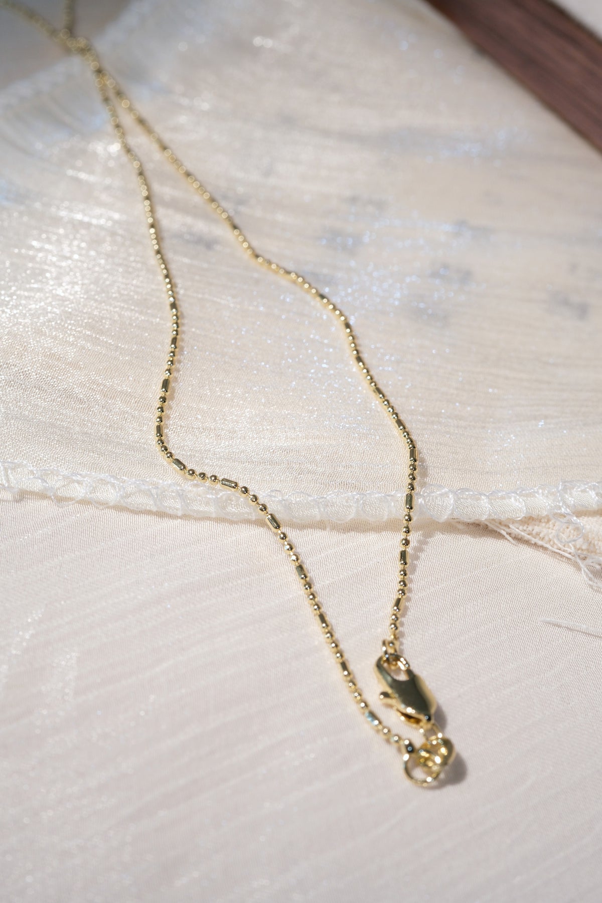 Ball and Bar Chain — Gold — edited real-life photo