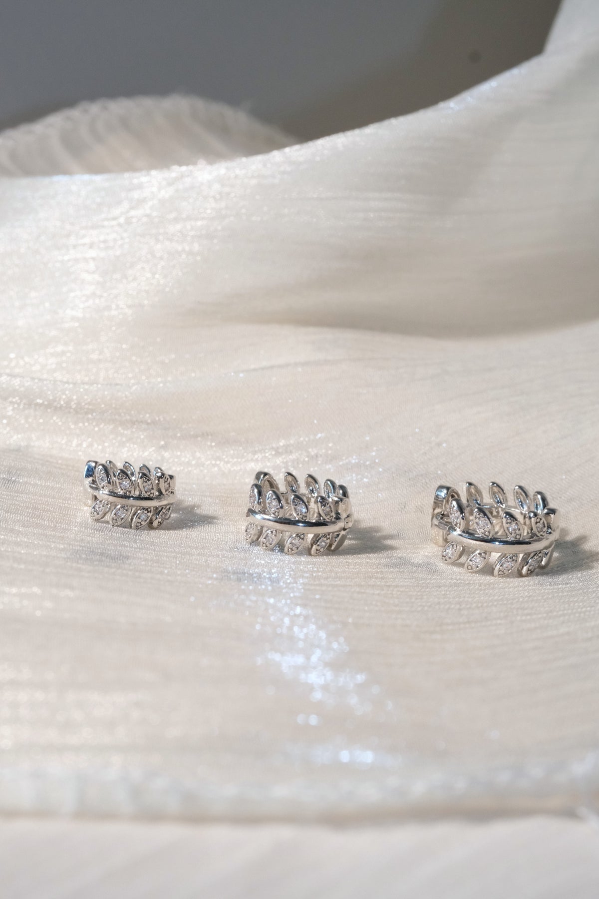 Leaf CZ Hoop Earrings — Silver — edited real-life photo