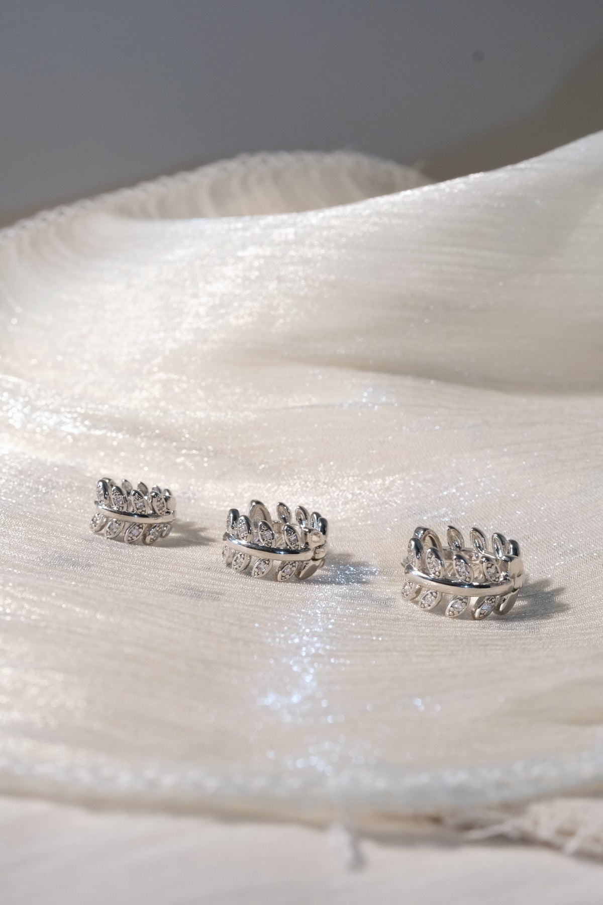 Leaf CZ Hoop Earrings — Silver — edited real-life photo