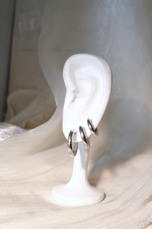 Rounded Polished Hoop Earrings — Silver — edited real-life photo