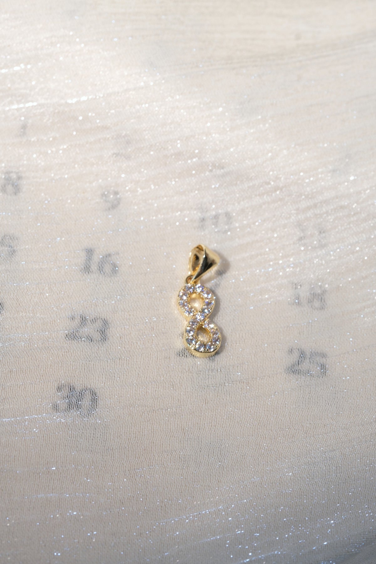 Infinity CZ Pendant — Gold — edited real-life photo