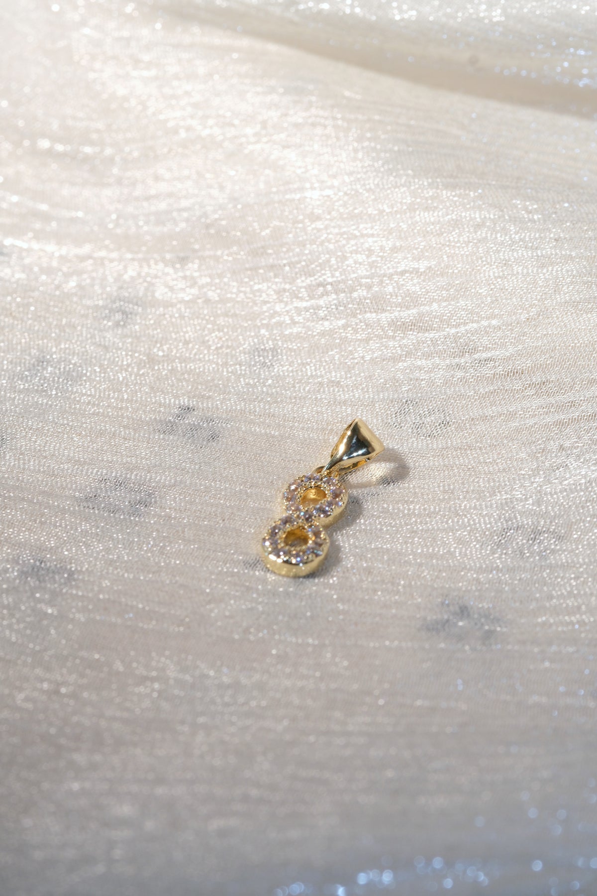 Infinity CZ Pendant — Gold — edited real-life photo