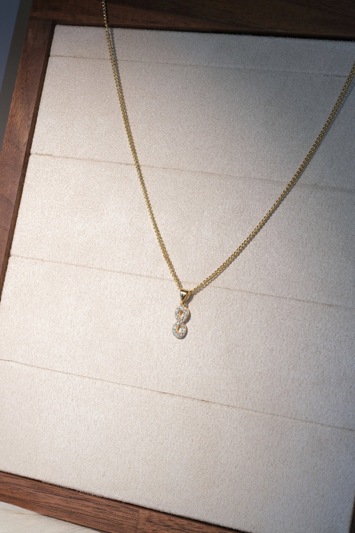 Infinity CZ Pendant — Gold — edited real-life photo