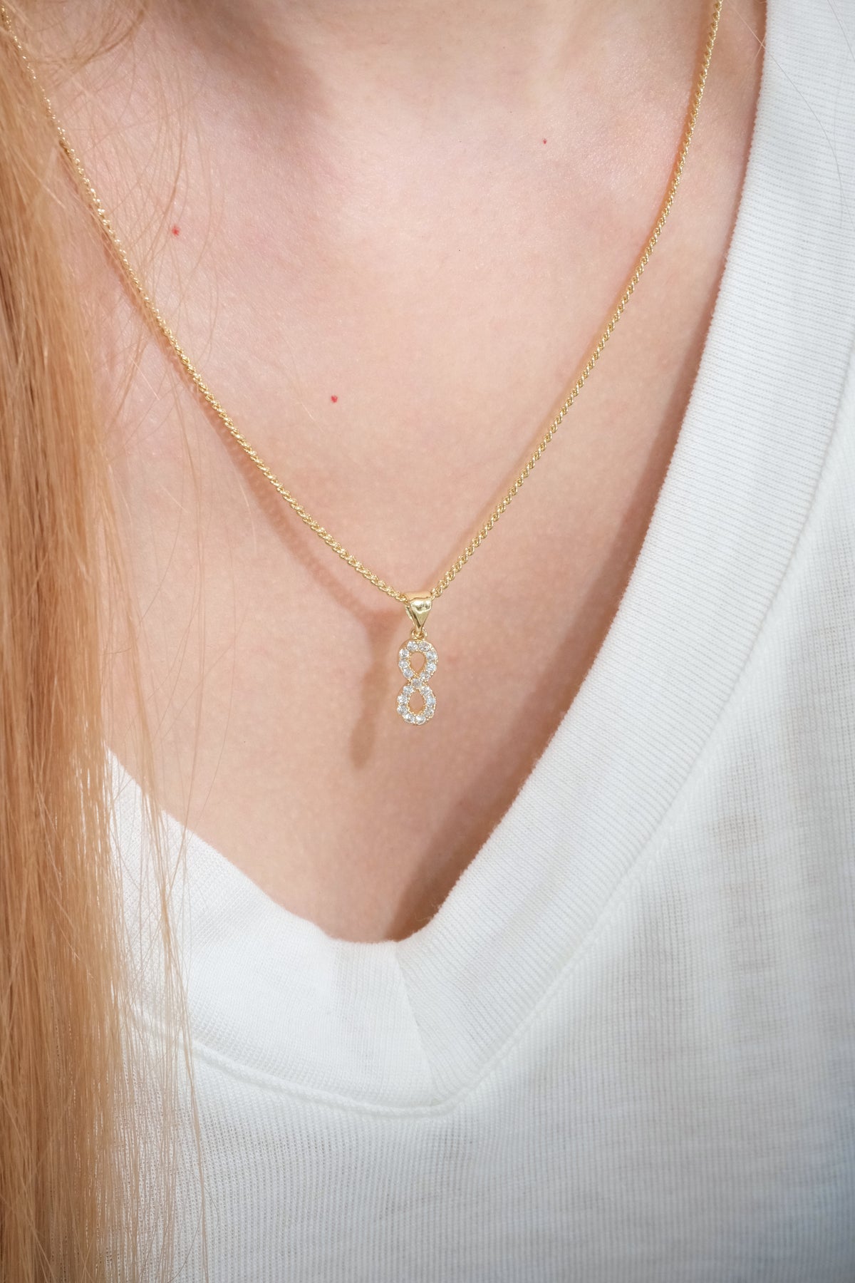 Infinity CZ Pendant — Gold — edited real-life photo