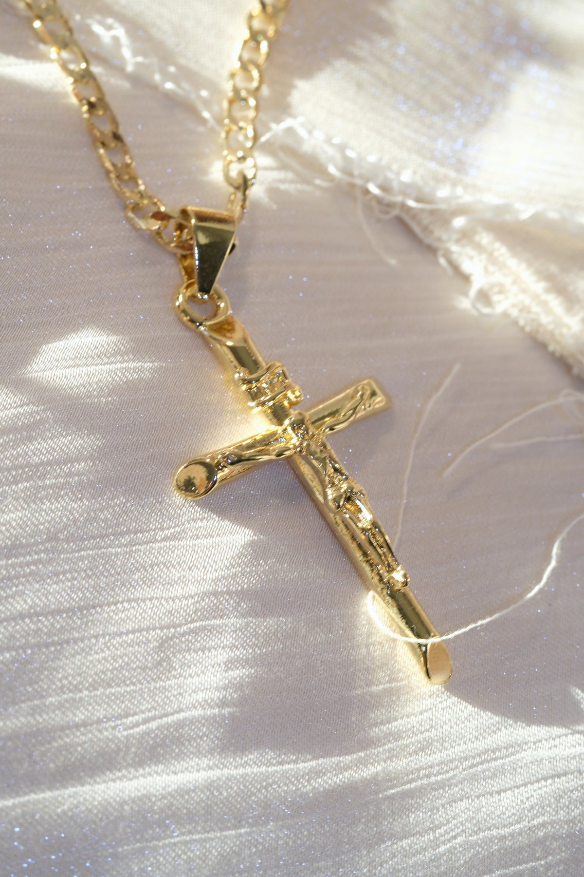 Long Crucifix Pendant — Gold — edited real-life photo