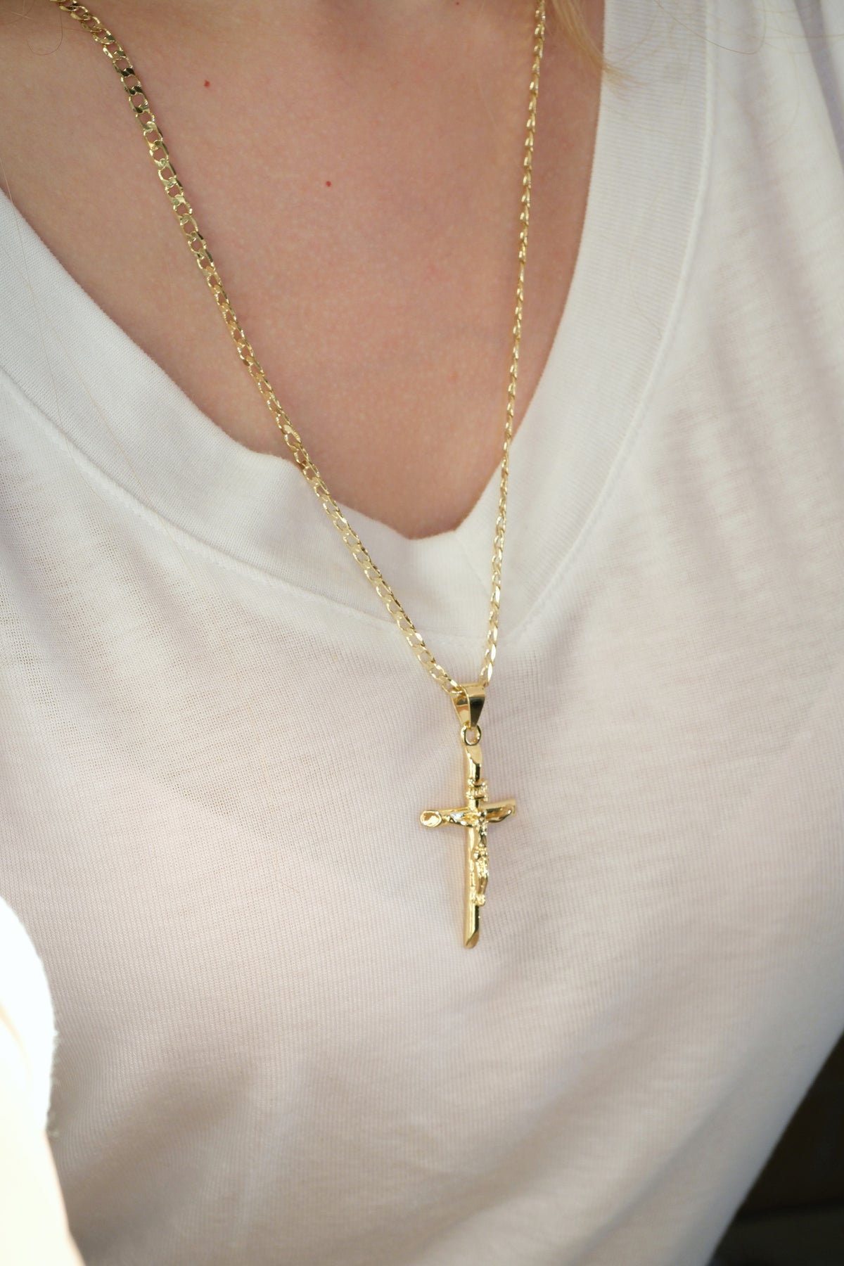 Long Crucifix Pendant — Gold — edited real-life photo