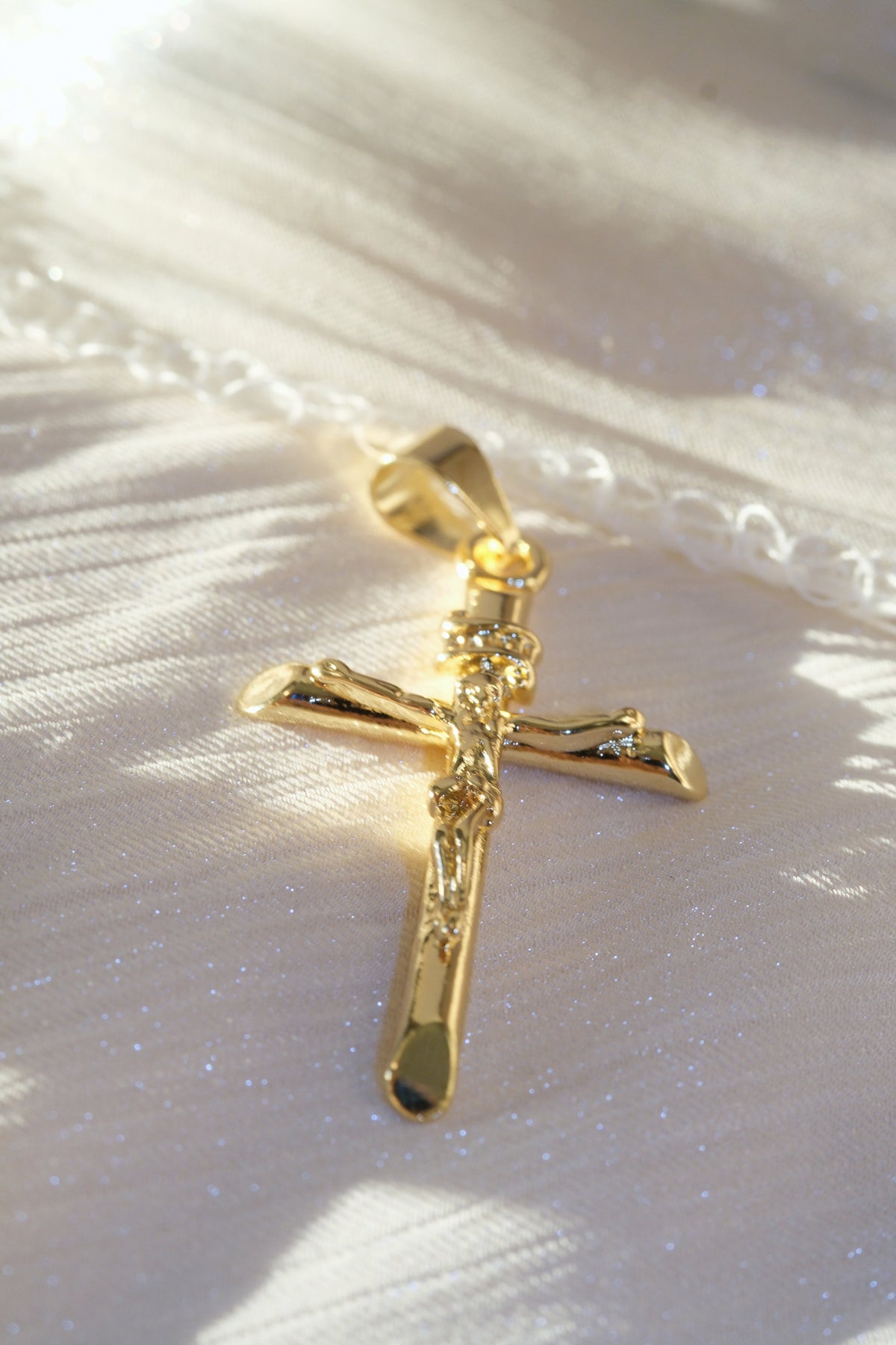 Long Crucifix Pendant — Gold — edited real-life photo