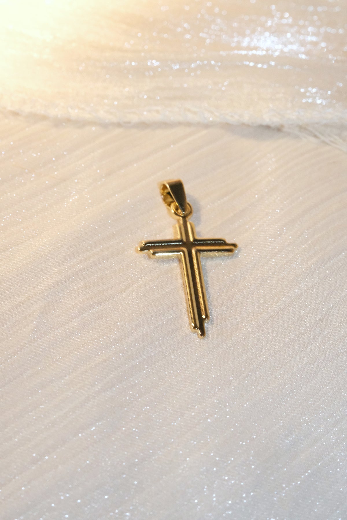 Slim Polished Cross Pendant — Gold — edited real-life photo