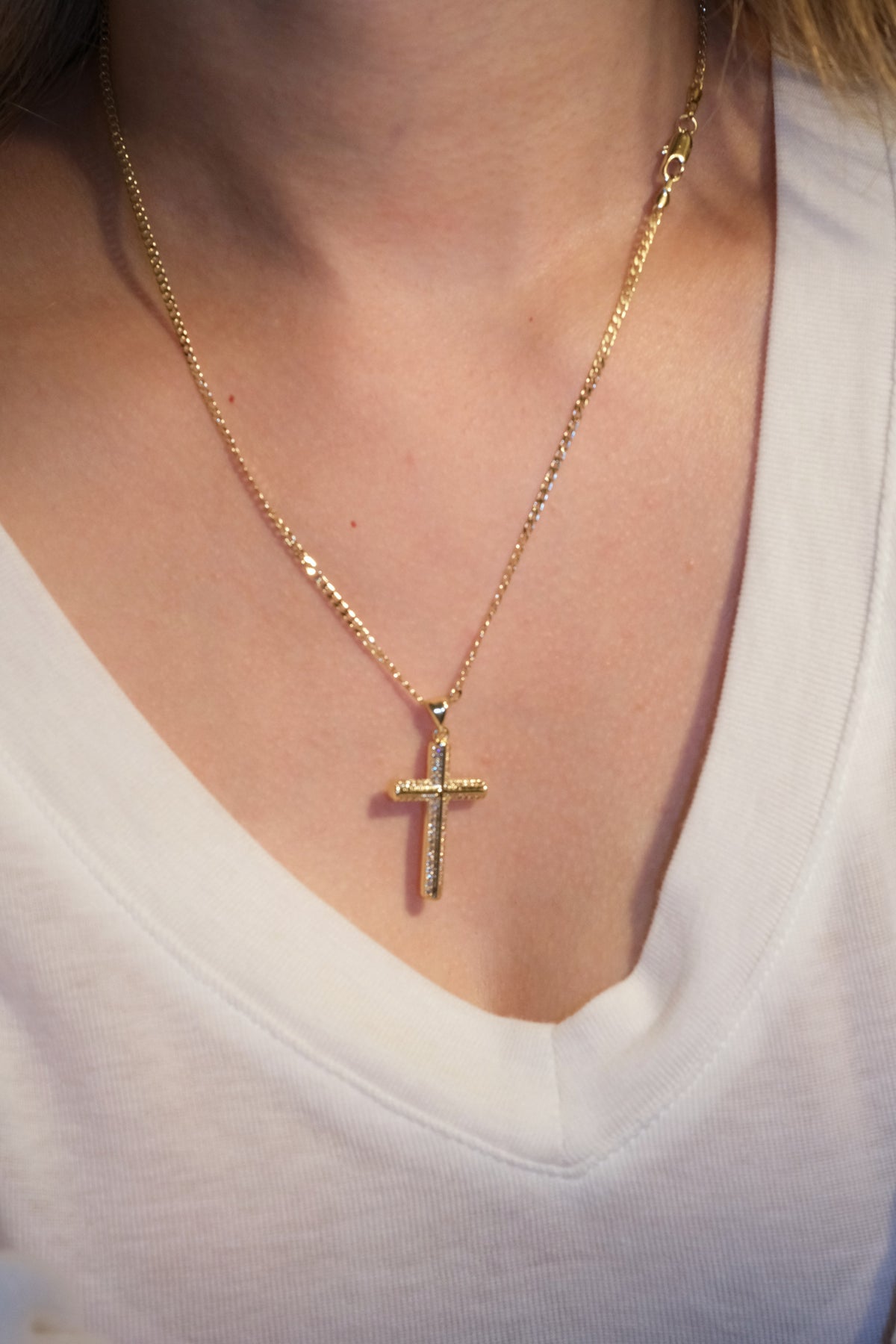 Outlined Cross Pendant — Gold — edited real-life photo