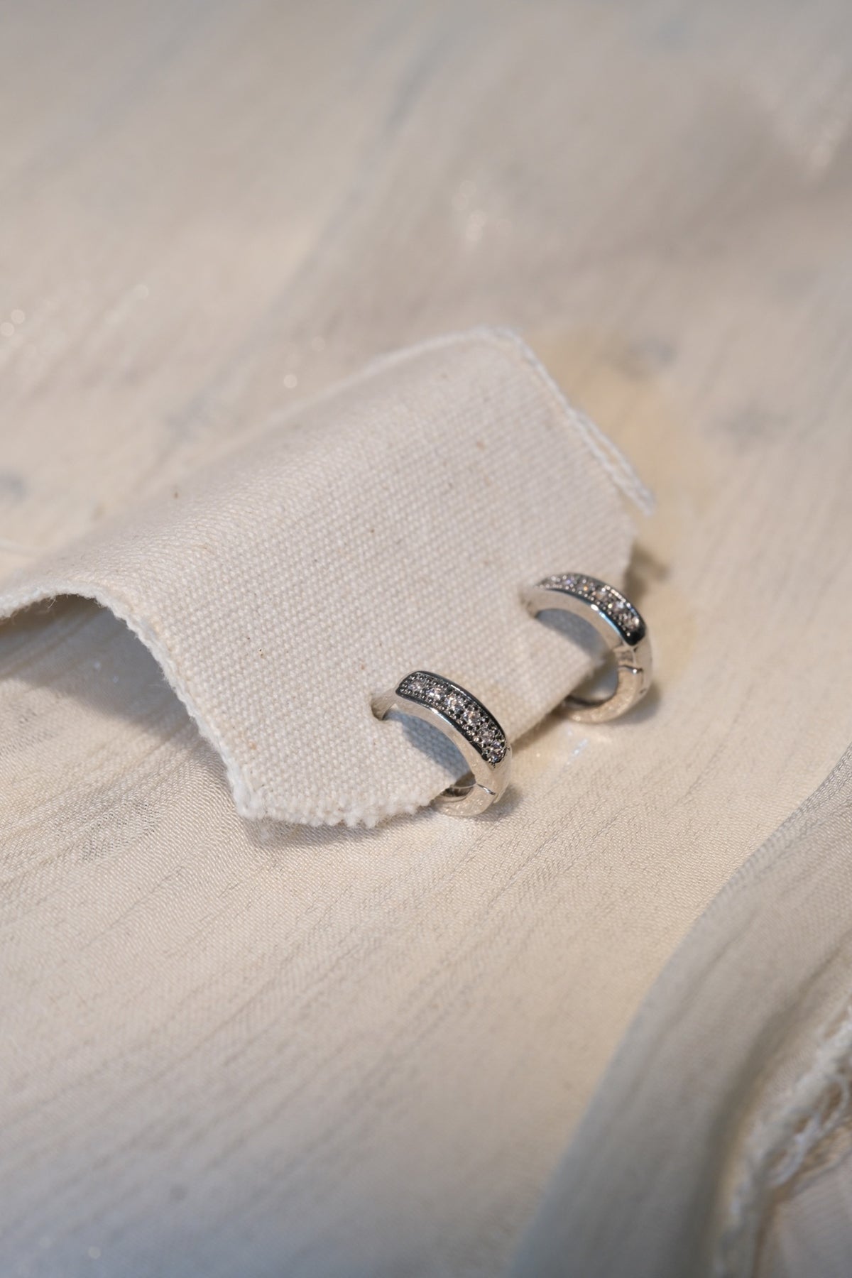 Pave Band Hoop Earrings — Silver — real-life photo