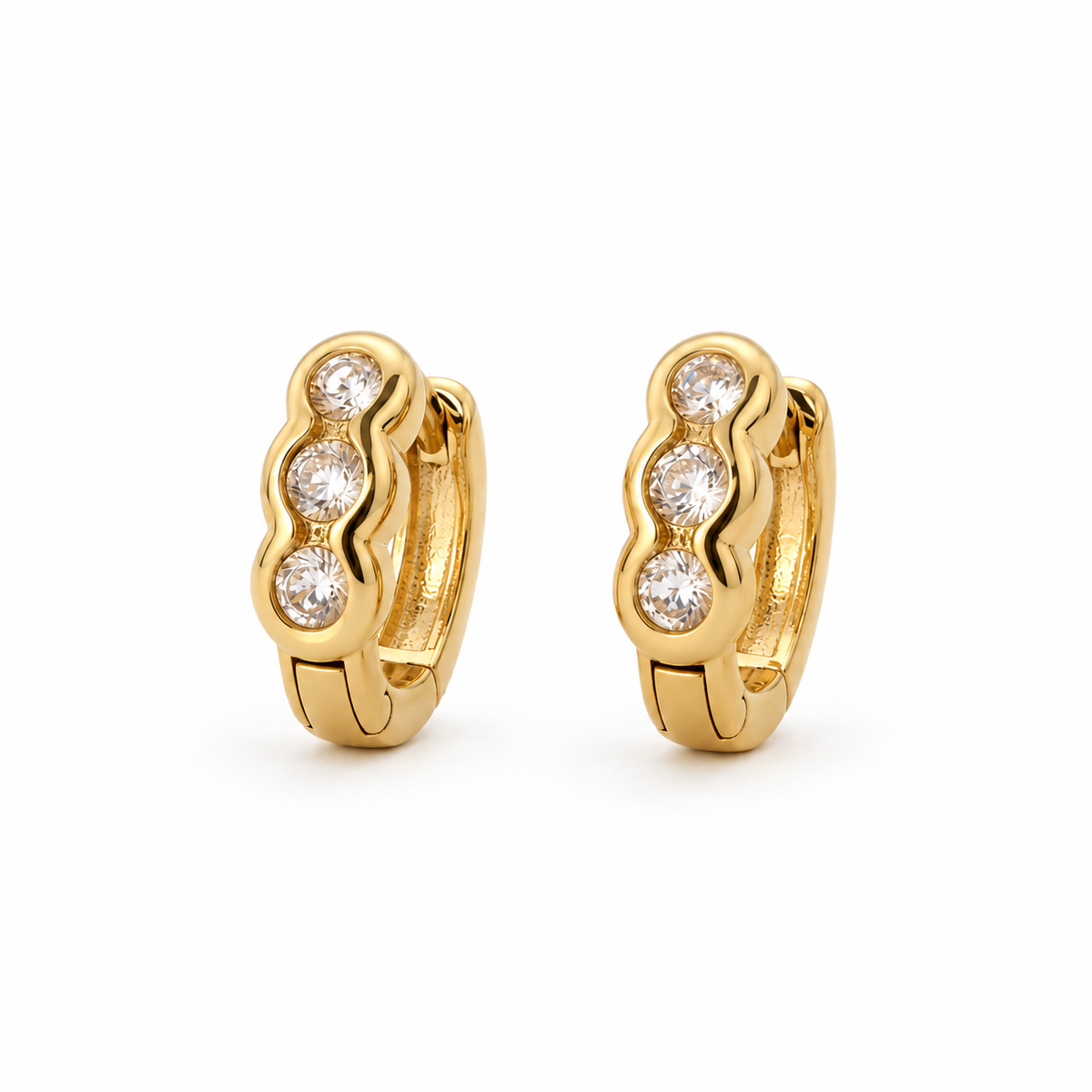 Ripple Three-Stone Wave CZ Huggie Hoops — white background product photo